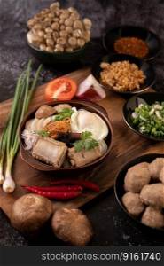 Guay Jap, meatballs, Vietnamese Pork Sausage and a fried egg, Thai food.