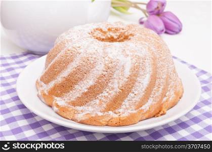 Guglhupf - Traditional Gugelhupf Sponge Cake and Tulip Flowers on Table