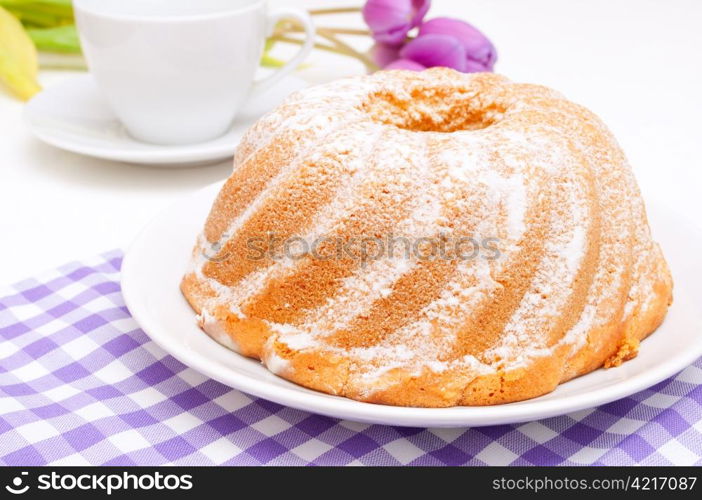 Guglhupf - Traditional Gugelhupf Sponge Cake and Tulip Flowers on Table