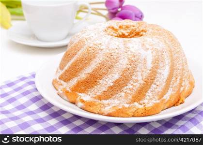 Guglhupf - Traditional Gugelhupf Sponge Cake and Tulip Flowers on Table