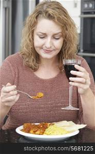 Guilty Woman Eating Takeaway Curry And Drinking Wine