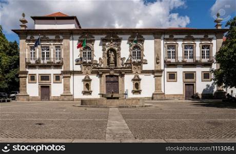 Guimaraes, Portugal - 18 August 2019: Courtyard and facade of the City or Town hall of Guimaraes in northern Portugal. Facade of the City or Town hall of Guimaraes in northern Portugal