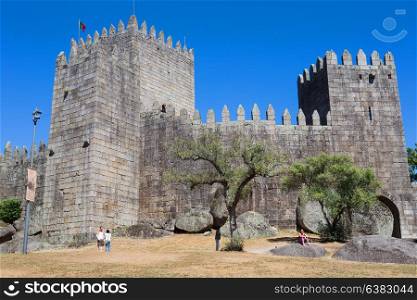 GUIMARAES, PORTUGAL - SEPTEMBER 18, 2016: people at the Castle of Guimaraes. The principal medieval castle in Portugal. Guimaraes, Portugal