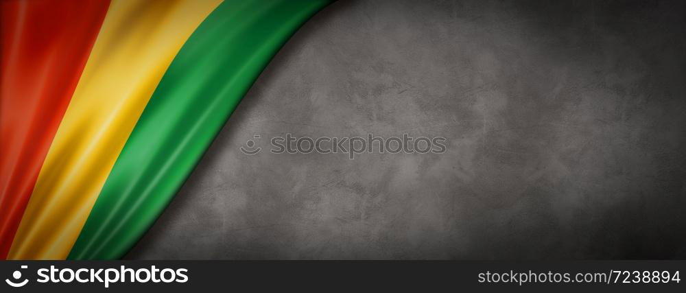 Guinea flag on concrete wall. Horizontal panoramic banner. 3D illustration. Guinean flag on concrete wall banner