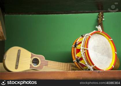 guitar and drum on a green background