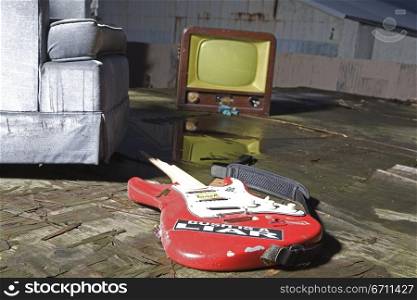Guitar, chair and a television
