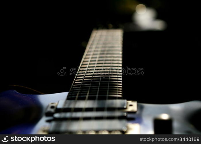 guitar head strings macro on black