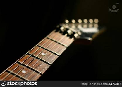 guitar head strings macro on black