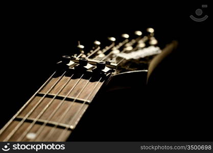 guitar head strings macro on black