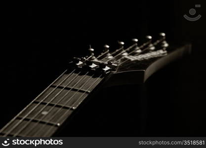 guitar head strings macro on black