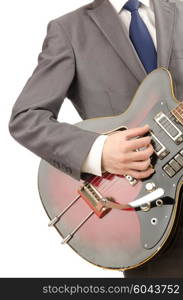 Guitar player in business suit on white