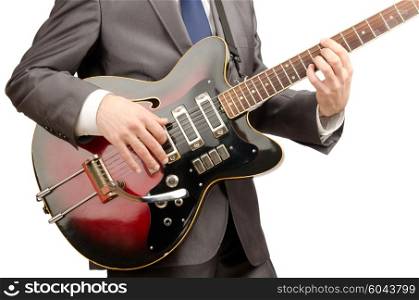 Guitar player in business suit on white