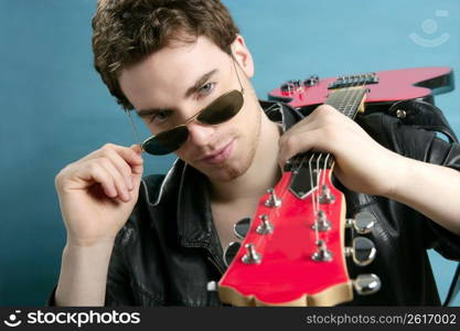 guitar rock star man sunglasses and leather perfect jacket over blue