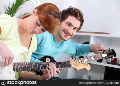 Guitar teacher and his student