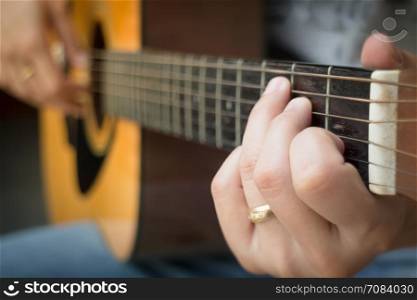 Guitarist Hand Playing Acoustic Guitar, stock photo