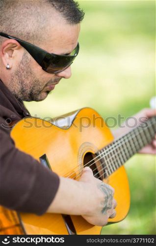Guitarist playing his guitar on the street