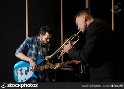 guitarist trumpet player performing