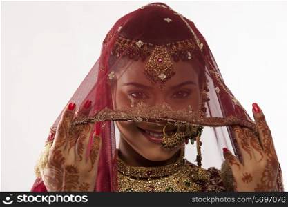 Gujarati brides face hidden behind a veil