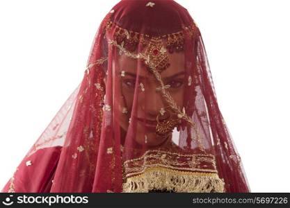 Gujarati brides face hidden behind a veil