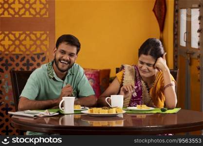 Gujrati couple eating dhokla during breakfast