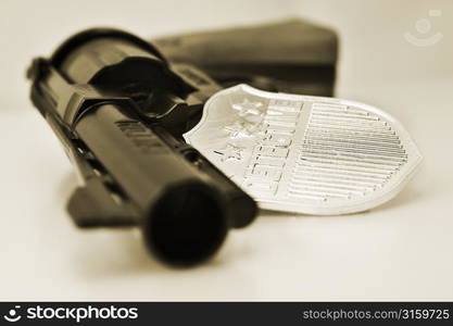 Gun and police badge