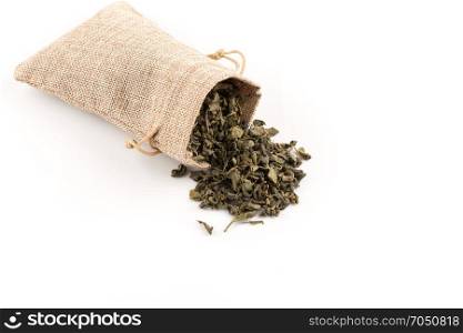 Gunpowder green tea in hessian sack closeup photo for background
