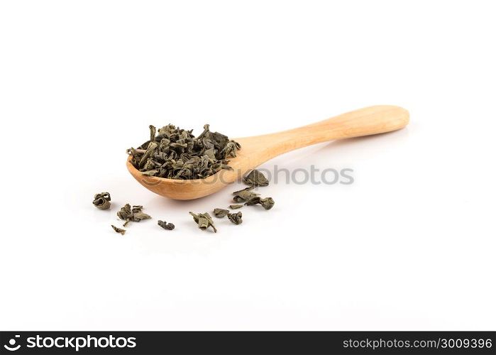 Gunpowder green tea in spoon isolated on a white background