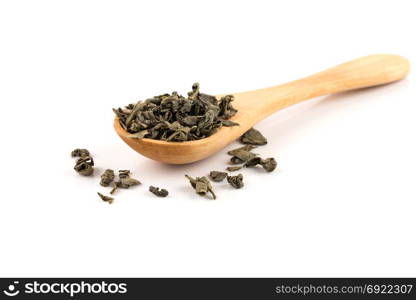 Gunpowder green tea in spoon isolated on a white background