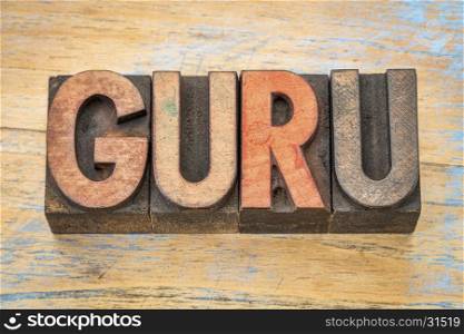 guru - word abstract in vintage letterpress wood type printing blocks