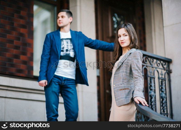 guy and a girl happily walk in the morning on the empty streets of old Europe