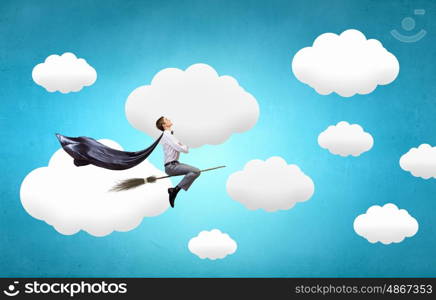 Guy on broom. Young businessman flying on broom high in sky