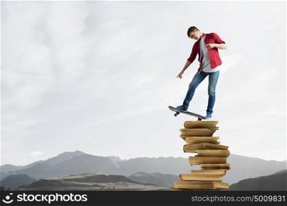 Guy on skateboard. Handsome teenager acive boy riding skateboard on books