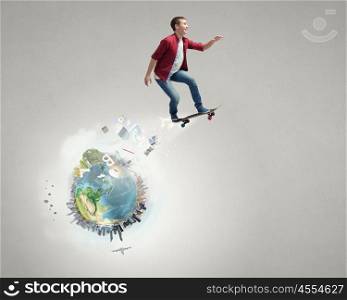 Guy on skateboard. Handsome teenager cool acive boy riding skateboard. Elements of this image are furnished by NASA