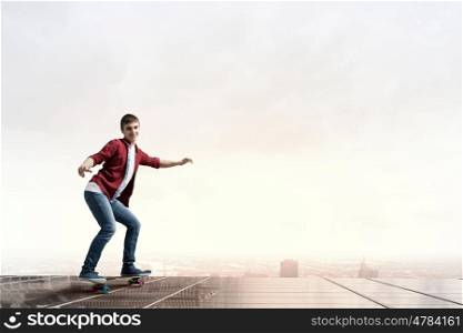 Guy on skateboard. Handsome teenager cool acive boy riding skateboard