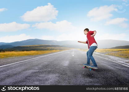 Guy on skateboard. Handsome teenager cool acive boy riding skateboard