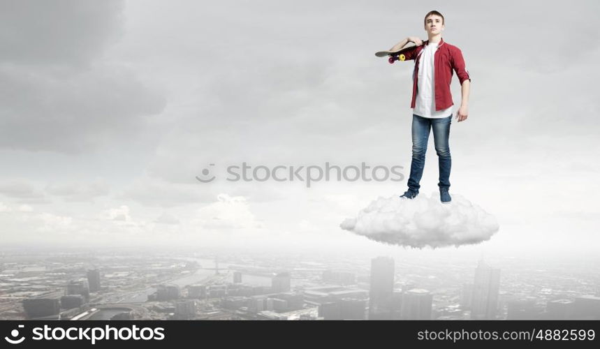 Guy on skateboard. Handsome teenager cool acive boy riding skateboard