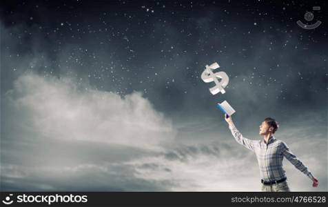 Guy studying finances. Young man in casual holding opened book with currency signs flying out
