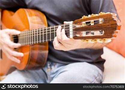 Guy with acousting guitar player performance