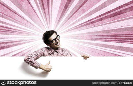 Guy with banner. Young man in casual holding white blank banner