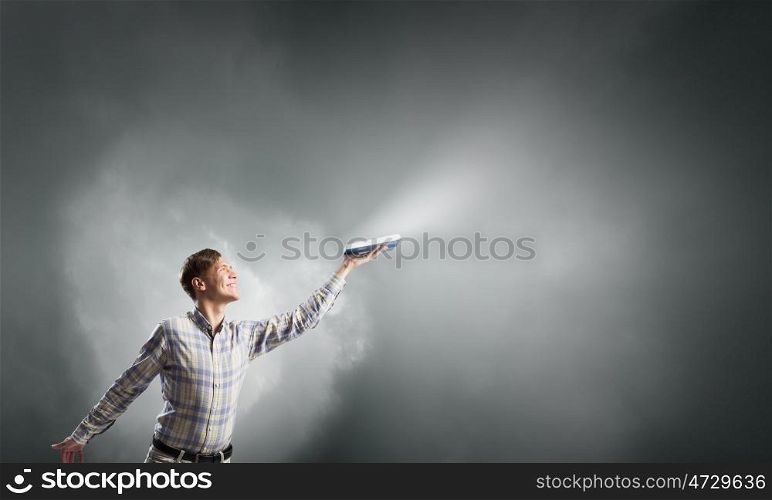 Guy with book in hands. Young man with book in hands and light coming from pages