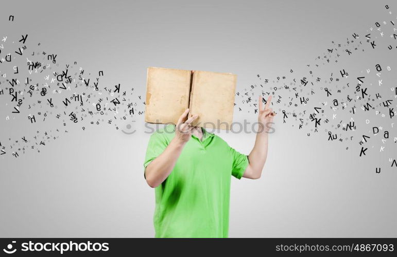 Guy with book. Young guy in casual holding book in hands