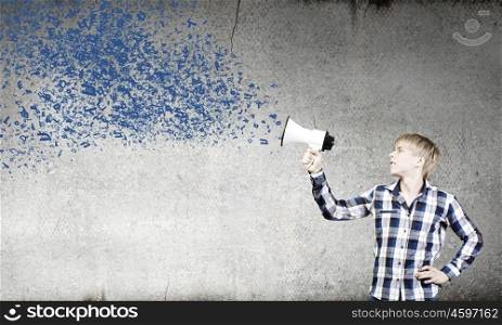 Guy with megaphone. Young man in casual announcing something in megaphone