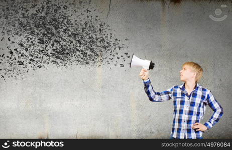 Guy with megaphone. Young man in casual announcing something in megaphone