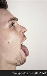 guy with mouth wide opened showin tongue