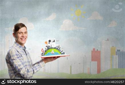 Guy with red book in hands. Young man in casual holding opened book with construction concept