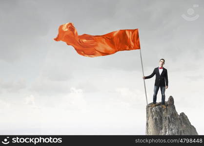 Guy with waving flag. Young student guy with color blank waving flag