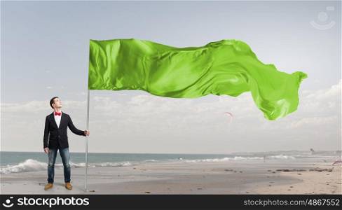 Guy with waving flag. Young student guy with color blank waving flag