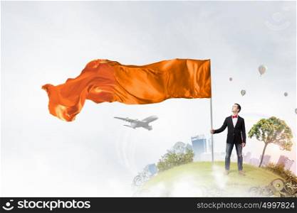Guy with waving flag. Young student guy with color blank waving flag