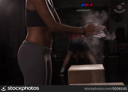 Gym Chalk Magnesium Carbonate hands clapping young african american woman for climbing workout