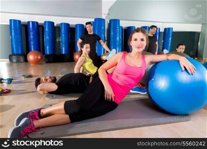 Gym people group relaxed after training with fitball workout